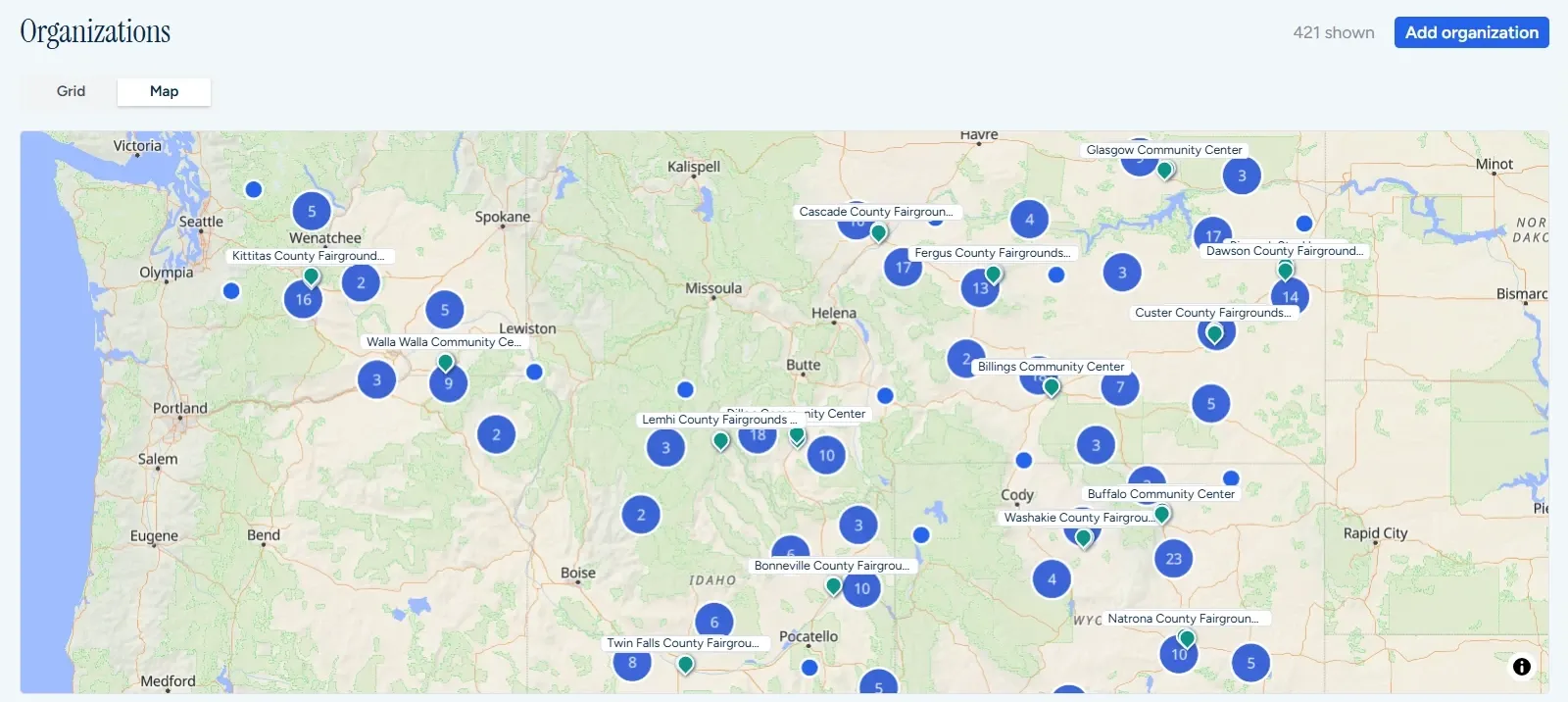 The Organizations map in ChapterIQ with every chapter shown. Numbered clusters of member organizations are spread across Washington, Idaho, Montana, Wyoming and Utah, and each chapter's usual venues, mostly county fairgrounds and community centers, are pinned and labelled by name.